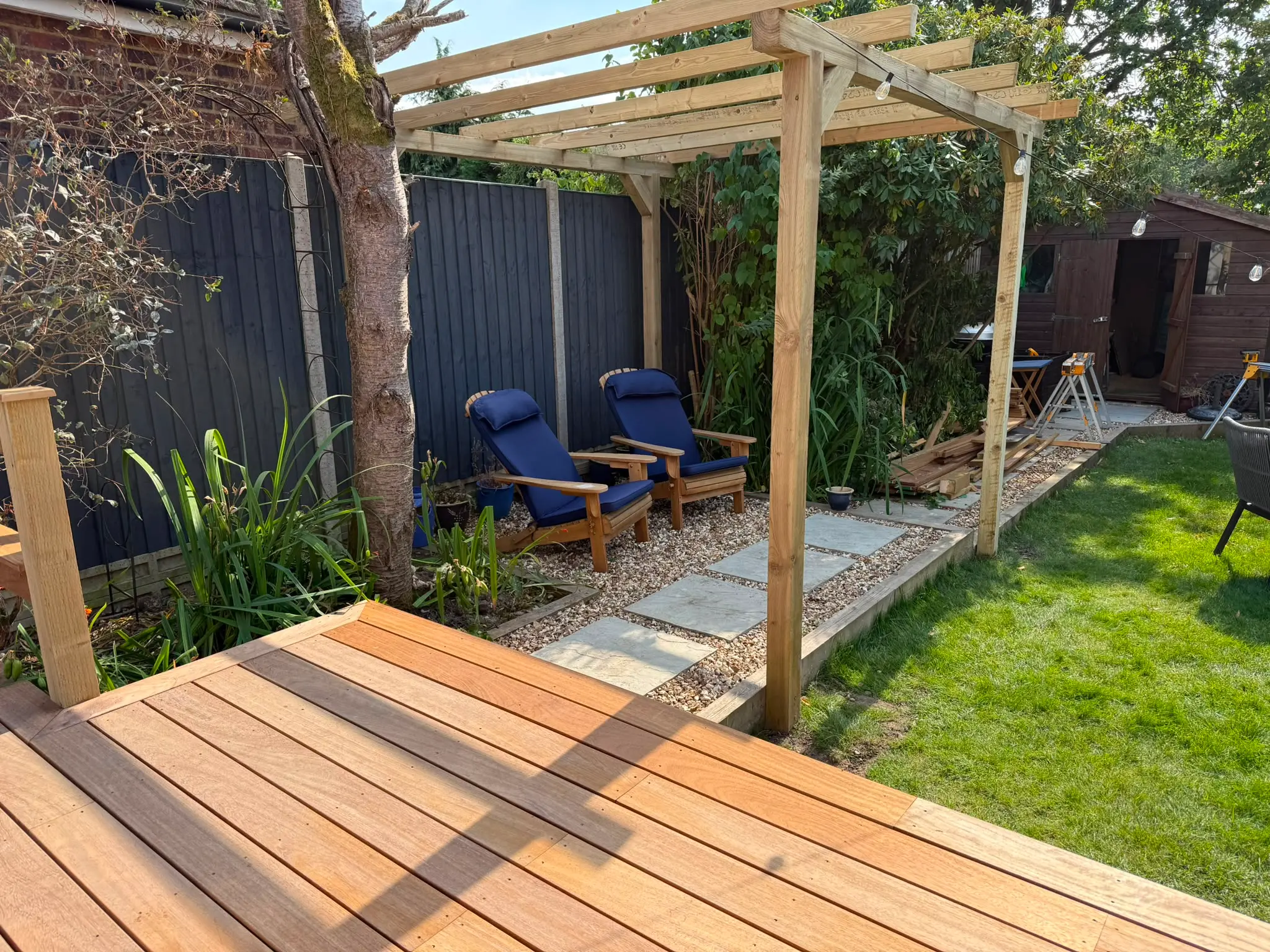 Completed hardwood deck with timber pergola and gravel seating area