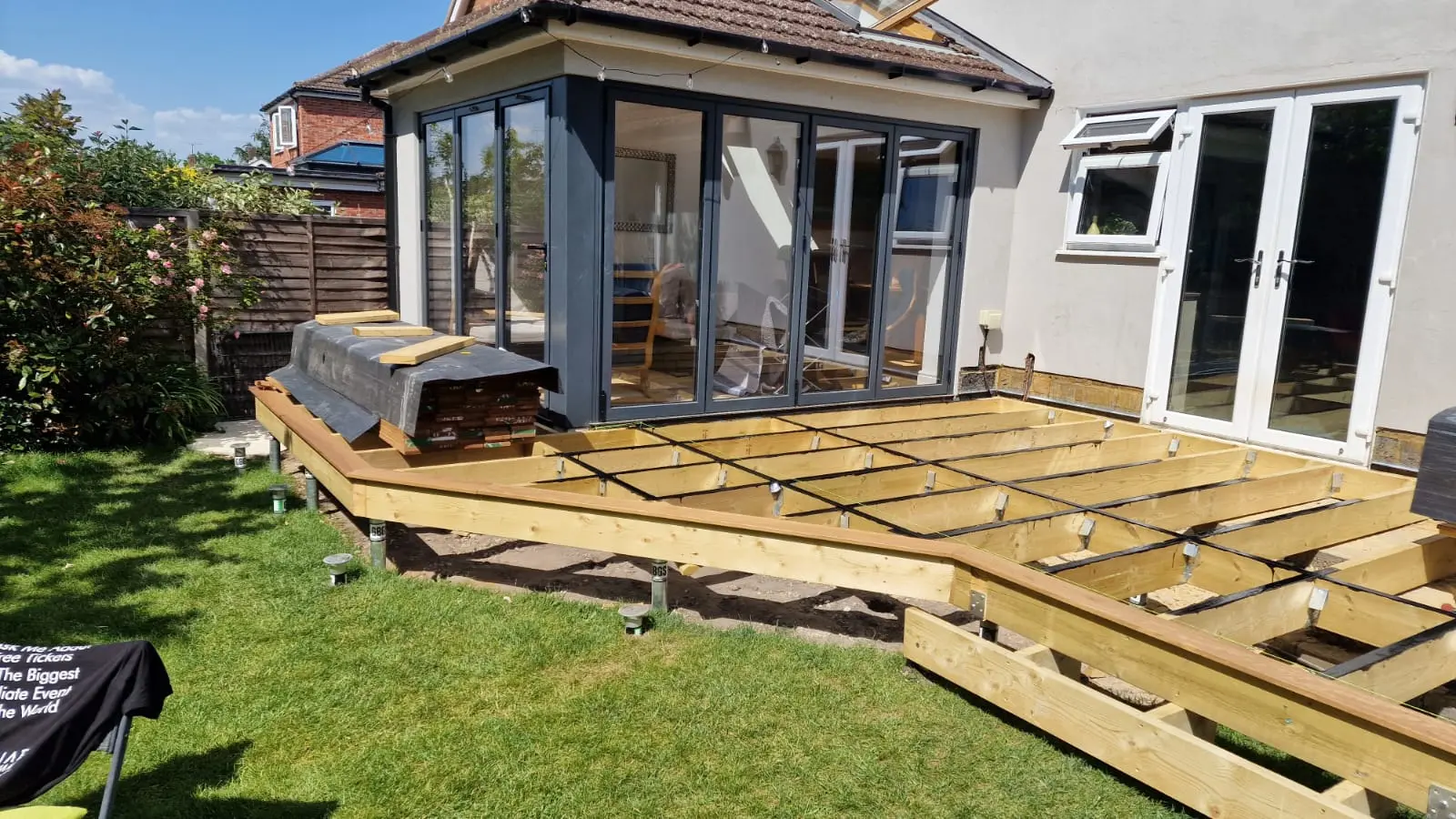 Deck joists on adjustable pedestals with joist tape, ready for boarding